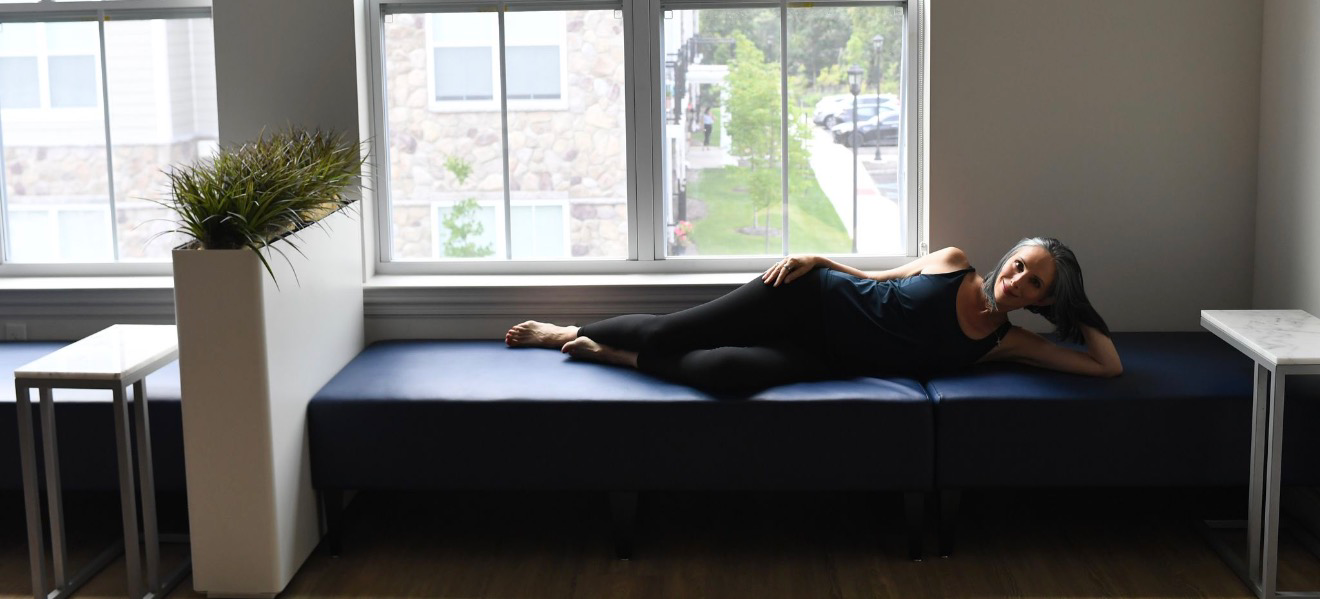 Gina Santangelo resting at the GLOW Body studio